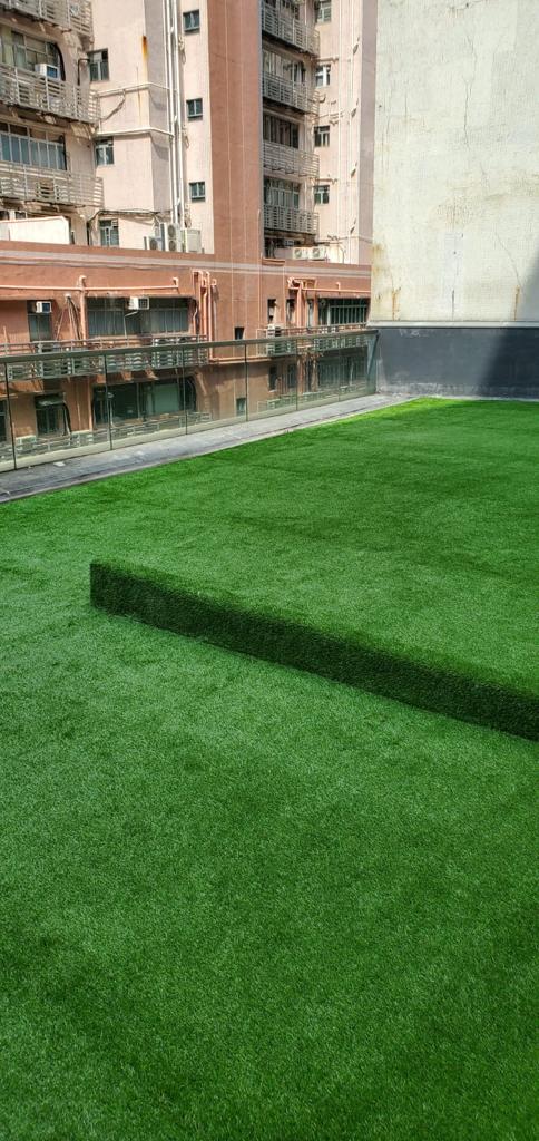 Artificial grass decoration on D2 Place rooftop common area.